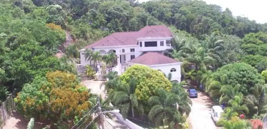 Beautiful designed Executive house 85% completed consisting of 5 Bed/5 bath/2 Powder Rooms , 6500 sq. ft. living space located in upscale Tripoli Heights Runaway Bay, St. Ann