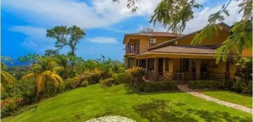 Nestled in the cool San San hills, Melarky is a four bedroom house filled with country charm set over three ivy-covered floors featuring classic Jamaican features and stunning views overlooking San San Bay