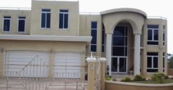 This contemporary styled home has 6 bedrooms and 6 bathrooms, 2 powder rooms and 1 unfinished bedroom and bathroom