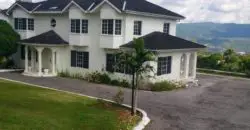 This Beautiful 4 Bedroom 4 Bathroom Estate two (2) storey home with an awesome view of the Mountains sits on 37,700 square of fruited land