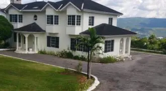 This Beautiful 4 Bedroom 4 Bathroom Estate two (2) storey home with an awesome view of the Mountains sits on 37,700 square of fruited land