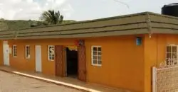 Commercial building front with 3 shops and 2 baths, rear is a dwelling house with 2 beds, 2 baths, kitchen etc
