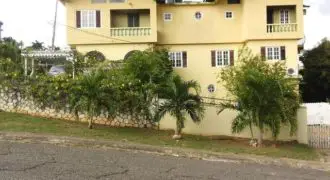 8 Bed 8 Bath house for sale in Spanish Town, you can easily convert it to three townhouses without compromising the structure