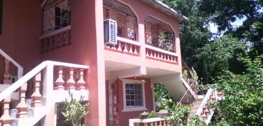 Great income earning house for sale, property is well fruited with banana, ackee, coconuts etc