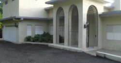 House for sale in Runaway Bay, solar energy ready, ocean view and private setting with beautifully landscaped grounds
