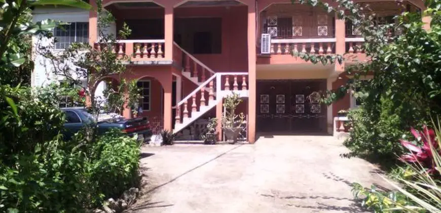 Great income earning house for sale, property is well fruited with banana, ackee, coconuts etc