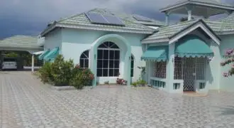 An attractive detached split level two storey residence that has an approximate floor area of 8,500 sqft