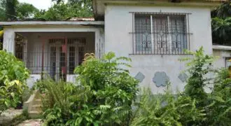 Fixer- Upper house just a few meters away from the busy thoroughfare of king Street, surrounded by three quarter acre of fruitful lands