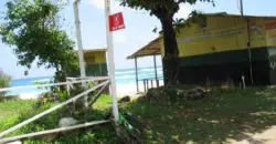 Just under 1/2 acre of beachfront land in Long Bay. The lot is level and receives all available services