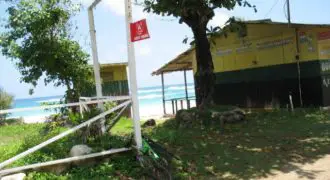 Just under 1/2 acre of beachfront land in Long Bay. The lot is level and receives all available services