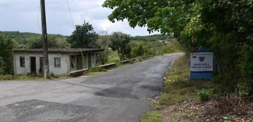 Property for sale consists of a building formerly used as a shop, the shop can be restored and used as a farm store grocery shops etc